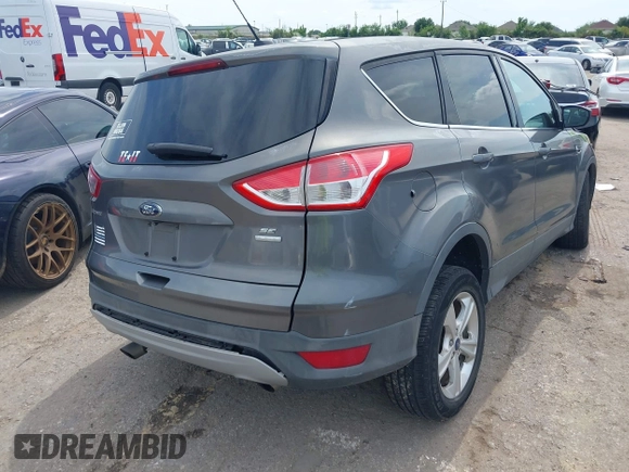2014 Ford Escape SE z VIN 1FMCU9GX9EUC01478, wystawiony jako IAAI lot #42370409 z przebiegiem 158 154 mil mil oraz . Historia ofert i sprzedaży dostępna na DreamBid. Obrazek 4.