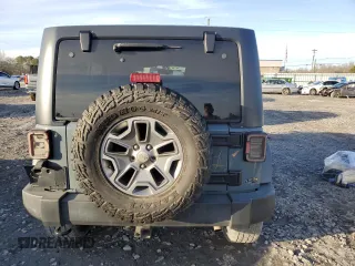 2015 Jeep Wrangler Unlimited Rubicon with VIN 1C4BJWFG7FL732694, listed as a Copart auction lot 42977435 with 128,759 mi miles and Salvage Title. Bid and sale history available at carsss.com. Image 6.