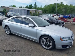 2013 Audi A8 3.0L z VIN WAURGAFD5DN029065, wystawiony jako IAAI lot #42135494 z przebiegiem 149 363 mil mil oraz . Historia ofert i sprzedaży dostępna na DreamBid. Obrazek 1.