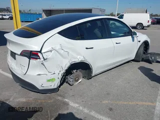 2020 Tesla Model Y Long Range with VIN 5YJYGDEE2LF044811, listed as a IAAI auction lot 41839136 with 68,445 mi miles and . Bid and sale history available at DreamBid. Image 4.
