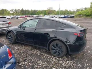 2024 Tesla Model Y Long Range z VIN 7SAYGDEE5RF130335, wystawiony jako IAAI lot #42250979 z przebiegiem 20 300 mil mil oraz . Historia ofert i sprzedaży dostępna na DreamBid. Obrazek 13.