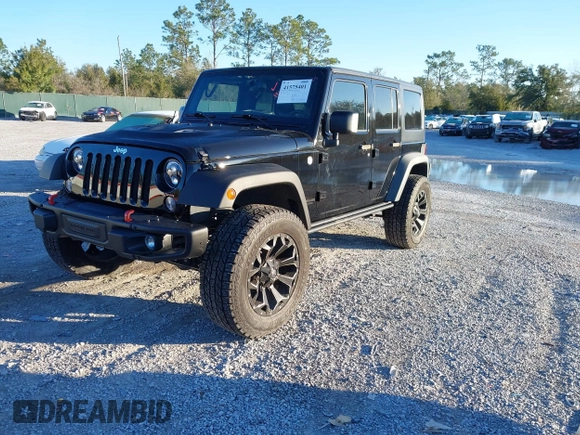 2015 Jeep Wrangler Unlimited Rubicon with VIN 1C4BJWFGXFL610153, listed as a IAAI auction lot 41575401 with 114,583 mi miles. Bid and sale history available at carsss.com. Image 17.