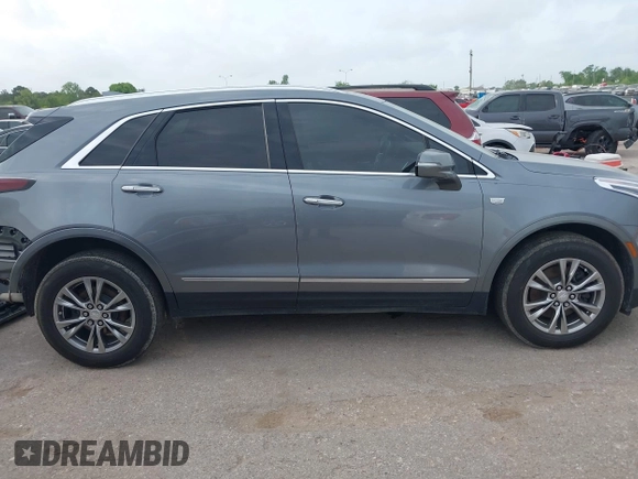 2021 Cadillac XT5 FWD Premium Luxury with VIN 1GYKNCRS5MZ128908, listed as a IAAI auction lot 41919571 with 51,280 mi miles and . Bid and sale history available at carsss.com. Image 14.