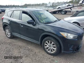 2014 Mazda CX-5 Sport with VIN JM3KE4BE4E0426931, listed as a IAAI auction lot 42055582 with 121,418 mi miles. Bid and sale history available at carsss.com. Image 1.