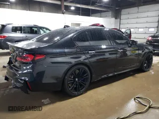 2018 BMW M5 z VIN WBSJF0C51JB282271, wystawiony jako Copart lot #60647265 z przebiegiem 63 765 mil mil oraz Szkoda całkowita • Salvage title. Historia ofert i sprzedaży dostępna na DreamBid. Obrazek 3.