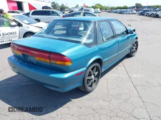 1995 Saturn SL with VIN 1G8ZK5277SZ320711, listed as a IAAI auction lot 42115543 with 77,558 mi miles and . Bid and sale history available at DreamBid. Image 4.