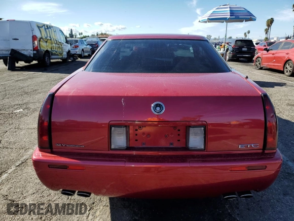 1999 Cadillac Eldorado Touring z VIN 1G6ET1293XU611368, wystawiony jako Copart lot #82683114 z przebiegiem 126 178 mil mil oraz Szkody całkowita. Historia ofert i sprzedaży dostępna na DreamBid. Obrazek 6.