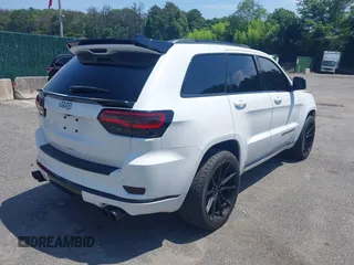 2019 Jeep Grand Cherokee Summit with VIN 1C4RJFJT1KC785744, listed as a IAAI auction lot 42645006 with 38,483 mi miles and . Bid and sale history available at DreamBid. Image 4.