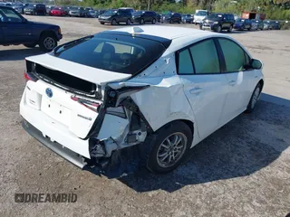 2022 Toyota Prius L Eco with VIN JTDKAMFUXN3163123, listed as a IAAI auction lot 41666679 with 68,026 mi miles. Bid and sale history available at carsss.com. Image 4.