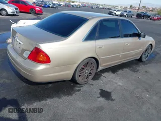 2001 Toyota Avalon XL w/Bucket Seats with VIN 4T1BF28BX1U117793, listed as a IAAI auction lot 42165172 with 247,435 mi miles. Bid and sale history available at carsss.com. Image 4.