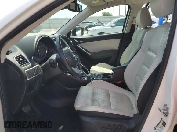 2016 Mazda CX-5 Grand Touring z VIN JM3KE2DYXG0731462, wystawiony jako Copart lot #58220465 z przebiegiem 130 033 mil mil oraz Szkoda całkowita • Salvage title. Historia ofert i sprzedaży dostępna na DreamBid. Obrazek 7.