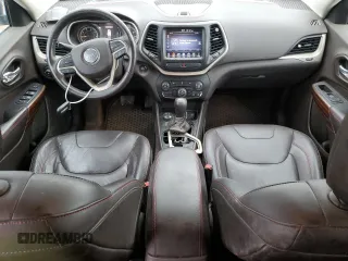 2015 Jeep Cherokee Trailhawk with VIN 1C4PJMBB6FW574108, listed as a Copart auction lot 57798475 with 105,022 mi miles and Salvage title. Bid and sale history available at DreamBid. Image 8.