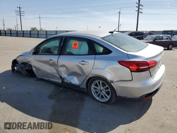 2015 Ford Focus SE with VIN 1FADP3F28FL241020, listed as a Copart auction lot 54559135 with 123,008 mi miles and Salvage title. Bid and sale history available at DreamBid. Image 2.