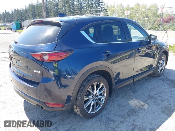 2019 Mazda CX-5 Signature with VIN JM3KFBEY7K0589236, listed as a IAAI auction lot 42078418 with 86,959 mi miles. Bid and sale history available at carsss.com. Image 4.