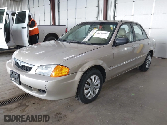 2000 Mazda Protege DX with VIN JM1BJ2221Y0239987, listed as a IAAI auction lot 42092488 with 140,756 mi miles and . Bid and sale history available at DreamBid. Image 2.