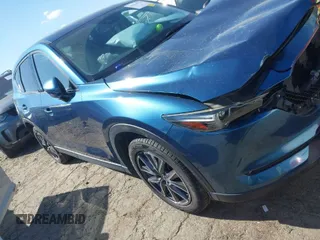 2017 Mazda CX-5 Grand Touring with VIN JM3KFADL8H0105518, listed as a IAAI auction lot 41876779 with 82,540 mi miles. Bid and sale history available at carsss.com. Image 1.