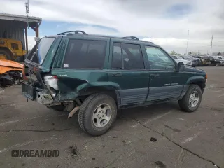 1996 Jeep Grand Cherokee Laredo with VIN 1J4GZ58S6TC165636, listed as a Copart auction lot 51485235 with 266,873 mi miles and Salvage Title. Bid and sale history available at carsss.com. Image 3.