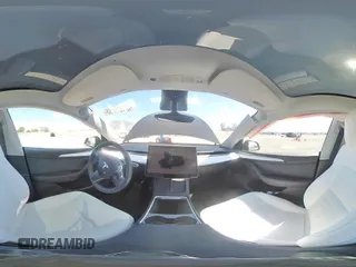2023 Tesla Model Y Long Range with VIN 7SAYGAEE0PF642810, listed as a Copart auction lot 52181655 with 74,922 mi miles and Salvage Title. Bid and sale history available at DreamBid. Image 12.