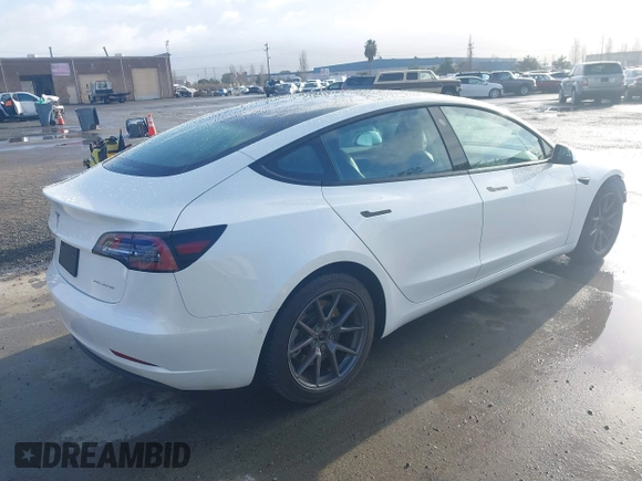 2021 Tesla Model 3 Long Range with VIN 5YJ3E1EB9MF055990, listed as a IAAI auction lot 41584065 with 49,147 mi miles and . Bid and sale history available at carsss.com. Image 4.