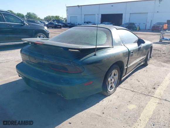 1996 Pontiac Firebird Formula with VIN 2G2FV22P5T2221912, listed as a IAAI auction lot 42004189 with 130,655 mi miles. Bid and sale history available at carsss.com. Image 4.