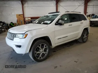 2021 Jeep Grand Cherokee Overland with VIN 1C4RJFCGXMC581141, listed as a Copart auction lot 56287295 with 59,477 mi miles and Salvage title. Bid and sale history available at DreamBid. Image 1.