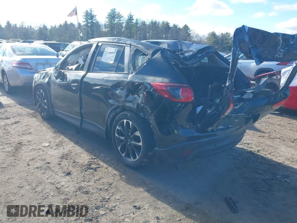 2016 Mazda CX-5 Grand Touring with VIN JM3KE4DY4G0909782, listed as a IAAI auction lot 41006111 with 30,135 mi miles. Bid and sale history available at carsss.com. Image 3.