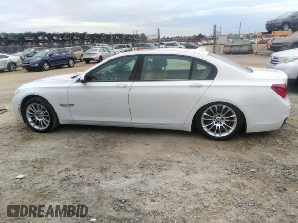 2015 BMW 7 Series 750Li with VIN WBAYE8C50FD781160, listed as a IAAI auction lot 41061232 with 154,496 mi miles. Bid and sale history available at carsss.com. Image 14.