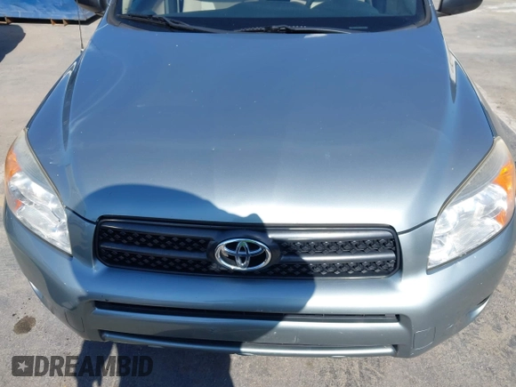 2006 Toyota RAV4 with VIN JTMZD33V465012121, listed as a IAAI auction lot 42013354 with 214,726 mi miles. Bid and sale history available at carsss.com. Image 6.