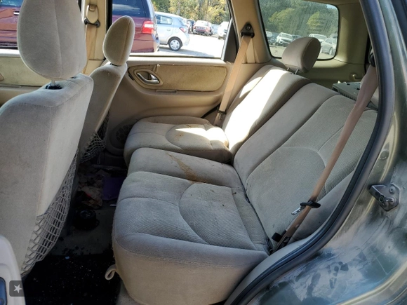 2002 Mazda Tribute LX with VIN 4F2YU09122KM62196, listed as a Copart auction lot 77327034 with 256,385 mi miles and Salvage Title. Bid and sale history available at carsss.com. Image 12.