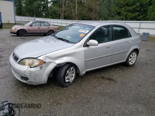 2005 Suzuki Reno S z VIN KL5JD66Z95K217050, wystawiony jako Copart lot #86785194 z przebiegiem 77 614 mil mil oraz Szkody całkowita. Historia ofert i sprzedaży dostępna na DreamBid. Obrazek 1.
