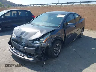 2021 Toyota Prius L Eco with VIN JTDKAMFU4M3144985, listed as a IAAI auction lot 42443957 with 20,816 mi miles and . Bid and sale history available at DreamBid. Image 18.