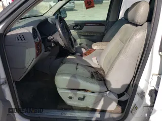 2005 GMC Envoy SLT with VIN 1GKDT13S052311455, listed as a Copart auction lot 73635434 with Not Provided miles and Salvage Title. Bid and sale history available at DreamBid. Image 7.