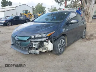 2018 Toyota Prius Plus with VIN JTDKARFPXJ3104302, listed as a IAAI auction lot 42127312 with 87,531 mi miles and . Bid and sale history available at DreamBid. Image 2.