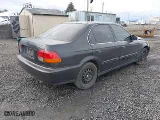 1997 Honda Civic LX with VIN 2HGEJ6677VH532411, listed as a IAAI auction lot 41181387 with 236559 miles. Bid and sale history available at carsss.com. Image 4.