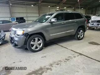 2013 Jeep Grand Cherokee Overland with VIN 1C4RJECT6DC526032, listed as a Copart auction lot 55660905 with 97,406 mi miles and Salvage Title. Bid and sale history available at DreamBid. Image 14.