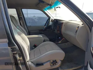 1999 Ford Explorer XL z VIN 1FMZU34XXXUB25039, wystawiony jako IAAI lot #42290828 z przebiegiem 146 874 mil mil oraz . Historia ofert i sprzedaży dostępna na DreamBid. Obrazek 5.