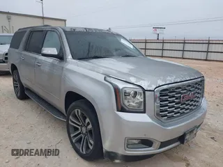 2019 GMC Yukon XL Denali with VIN 1GKS1HKJ0KR257673, listed as a IAAI auction lot 41375951 with 71,291 mi miles. Bid and sale history available at carsss.com. Image 1.
