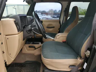 2002 Jeep Wrangler Sahara with VIN 1J4FA59S22P771136, listed as a Copart auction lot 51528665 with 236,882 mi miles and Salvage title. Bid and sale history available at DreamBid. Image 7.