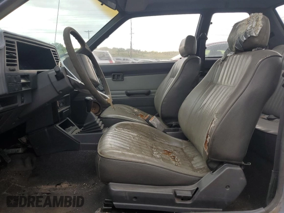 1987 Nissan Sentra z VIN JN1PB2210HU557007, wystawiony jako Copart lot #68174784 z przebiegiem 150 316 mil mil oraz Czysty tytuł • Clean title. Historia ofert i sprzedaży dostępna na DreamBid. Obrazek 7.