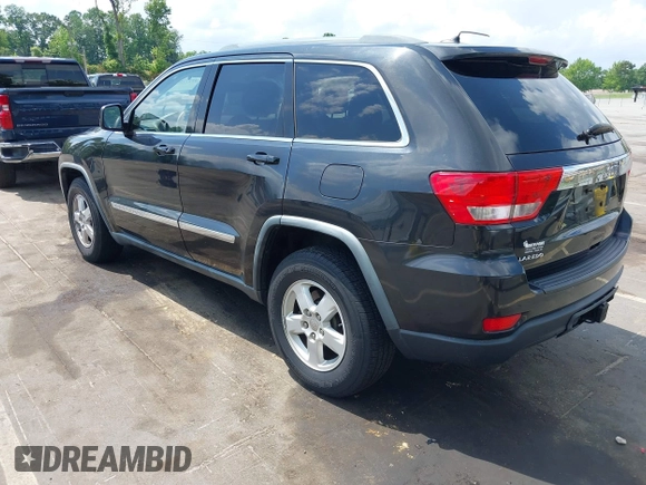2011 Jeep Grand Cherokee Laredo with VIN 1J4RS4GG5BC534960, listed as a IAAI auction lot 42277395 with 223,690 mi miles and . Bid and sale history available at DreamBid. Image 3.