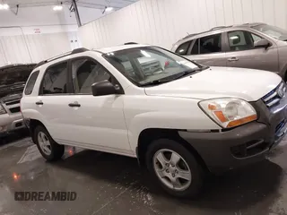 2007 Kia Sportage LX with VIN KNDJF724877399530, listed as a IAAI auction lot 41696698 with 124,967 mi miles. Bid and sale history available at carsss.com. Image 13.
