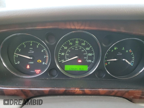 2005 Jaguar XJ with VIN SAJWA79C55SG37981, listed as a Copart auction lot 81142484 with 128,601 mi miles and Salvage Title. Bid and sale history available at carsss.com. Image 9.
