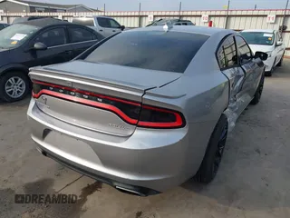 2015 Dodge Charger SXT with VIN 2C3CDXHG4FH884058, listed as a IAAI auction lot 41724894 with 202,701 mi miles and . Bid and sale history available at DreamBid. Image 4.