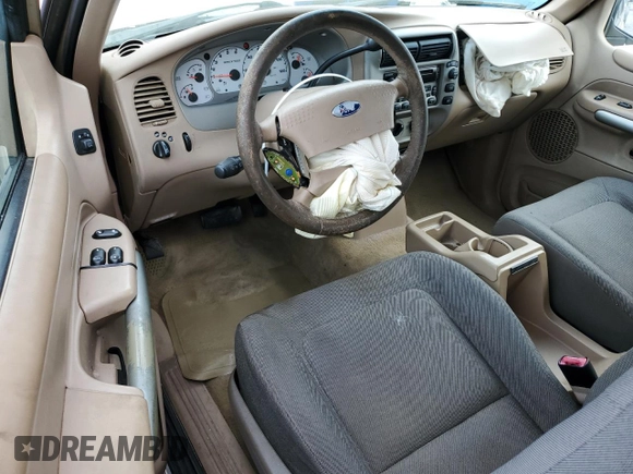 2002 Ford Explorer Sport Value with VIN 1FMYU60EX2UC31677, listed as a Copart auction lot 46415785 with 104,684 mi miles and Salvage title. Bid and sale history available at DreamBid. Image 8.