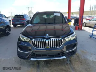 2021 BMW X1 sDrive28i with VIN WBXJG7C02M5S59010, listed as a IAAI auction lot 41933532 with 49,207 mi miles. Bid and sale history available at carsss.com. Image 12.