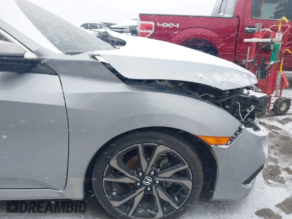 2019 Honda Civic Sport with VIN 2HGFC2F85KH605786, listed as a IAAI auction lot 41621480 with 66,438 mi miles and . Bid and sale history available at DreamBid. Image 22.