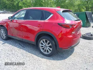 2021 Mazda CX-5 Grand Touring with VIN JM3KFBDM3M0434569, listed as a IAAI auction lot 42422349 with 25,924 mi miles and . Bid and sale history available at DreamBid. Image 3.