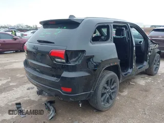 2018 Jeep Grand Cherokee Laredo E with VIN 1C4RJFAG5JC280033, listed as a IAAI auction lot 41953744 with 69,269 mi miles and . Bid and sale history available at DreamBid. Image 4.