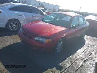 1999 Ford Escort SE with VIN 1FAFP13P6XW180845, listed as a IAAI auction lot 41398242 with 59,300 mi miles. Bid and sale history available at carsss.com. Image 2.