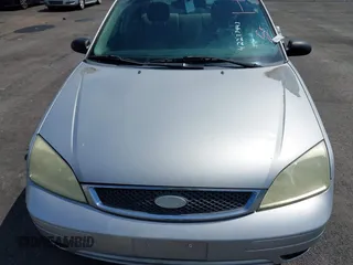 2006 Ford Focus S z VIN 1FAFP34N66W203290, wystawiony jako IAAI lot #42273443 z przebiegiem 193 482 mil mil oraz . Historia ofert i sprzedaży dostępna na DreamBid. Obrazek 10.